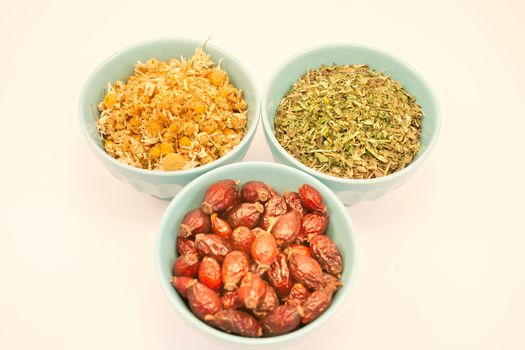 Tea herb in bowls on white background