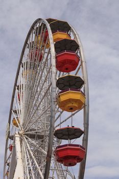 Under the Ferris wheel on the Santa Monica Pier boardwalk in Southern California.