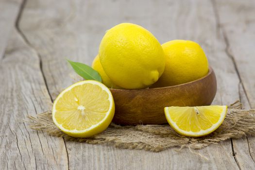 fresh lemons on wooden background