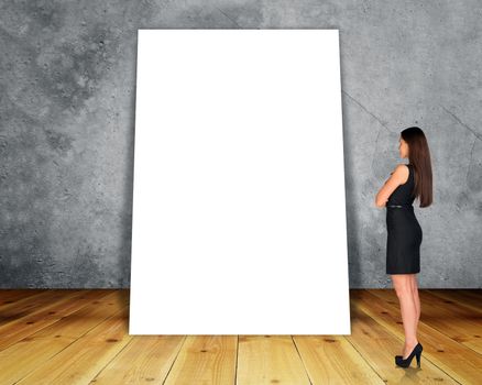 Big blank banner with businesswoman on grey wall background