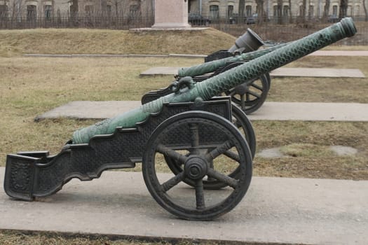 old medieval bronze cannon on the gun carriage 