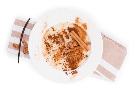 Delicious porridge breakfast with cinnamon and cocoa powder. Traditional breakfast eating. 