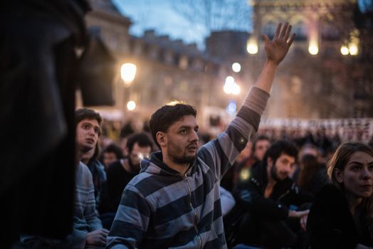 FRANCE, Paris: Hundreds of militants of the Nuit Debout or Standing night movement hold a general assembly to vote about the developments of the movement at the Place de la Republique in Paris on April 3, 2016. It has been four days that hundred of people have occupied the square to show, at first, their opposition to the labour reforms in the wake of the nationwide demonstration which took place on March 31, 2016.