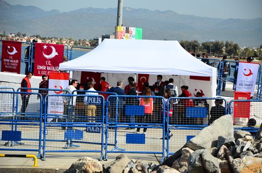 TURKEY, Dikili: A Red Crescent tent has been set in Dikili harbor to welcome migrants who are deported from Lesbos and Chios islands in Greece to Turkey, on April 4, 2016 in the port of Dikili, in Izmir district. Migrants return from Greece to Turkey begun under the terms of an EU deal that has worried aid groups, as Athens struggles to manage the overload of desperate people on its soil. Over 51,000 refugees and migrants seeking to reach northern Europe are stuck in Greece, after Balkan states sealed their borders. Hundreds more continue to land on the Greek islands every day despite the EU deal.