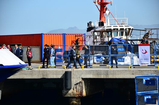 TURKEY, Dikili: A small Turkish ferry carrying migrants who are deported from Lesbos and Chios islands in Greece to Turkey, arrive on April 4, 2016 in the port of Dikili, in Izmir district. Migrants return from Greece to Turkey begun under the terms of an EU deal that has worried aid groups, as Athens struggles to manage the overload of desperate people on its soil. Over 51,000 refugees and migrants seeking to reach northern Europe are stuck in Greece, after Balkan states sealed their borders. Hundreds more continue to land on the Greek islands every day despite the EU deal.
