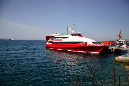 TURKEY, Dikili: A small Turkish ferry carrying migrants who are deported from Lesbos and Chios islands in Greece to Turkey, arrive on April 4, 2016 in the port of Dikili, in Izmir district. Migrants return from Greece to Turkey begun under the terms of an EU deal that has worried aid groups, as Athens struggles to manage the overload of desperate people on its soil. Over 51,000 refugees and migrants seeking to reach northern Europe are stuck in Greece, after Balkan states sealed their borders. Hundreds more continue to land on the Greek islands every day despite the EU deal.