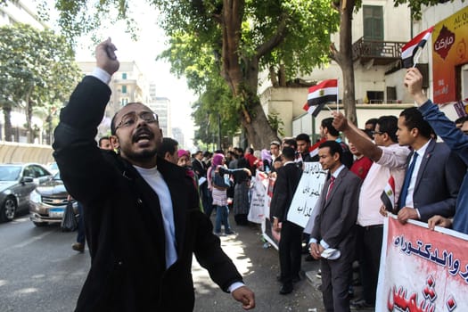 EGYPT, Cairo: A demonstrator chants during a rally in Cairo, Egypt on April 4, 2016, over the uselessness of their degrees after they cannot find jobs. The protesters are demanding to be appointed to jobs in the state administration. 