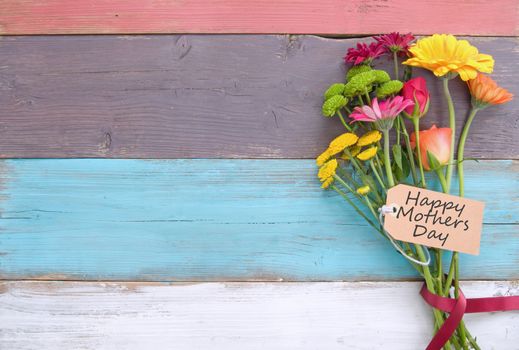 Assorted flower gift label on wooden background