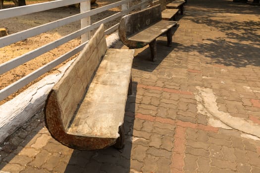 few wooden benches standing in the park