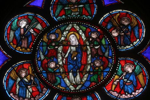 Colorful stained glass window in Cathedral Notre Dame de Paris