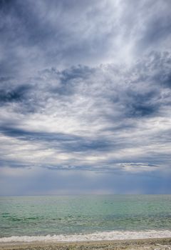 rainstorm, heavy overcast raiclouds over the sea