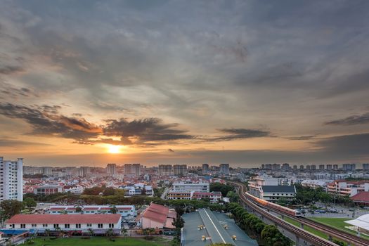 Sunrise over Eunos residential area by MRT train station in Singapore