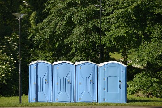 Old blue mobile toilet cabins