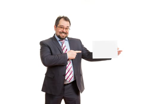 the adult man holds a sheet of paper in hand