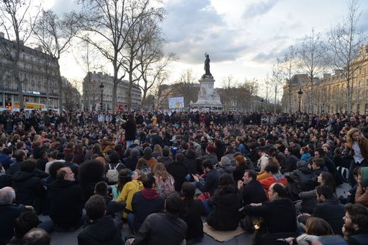 FRANCE, Paris: Hundreds of militants of the Nuit Debout or Standing night movement hold a general assembly to vote about the developments of the movement at the Place de la Republique in Paris on April 4, 2016. It has been five days that hundred of people have occupied the square to show, at first, their opposition to the labour reforms in the wake of the nationwide demonstration which took place on March 31, 2016.