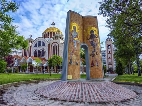 Church of Saints Cyril and Methodius in Thessaloniki, Greece, surrounded by trees by beautiful weather. Saints Cyril and Methodius were born in the 9th century in Thessaloniki, Greece, and were two Bizantine Greek brothers. Cyrillic alphabet, still used in slavic countries, is based on an alphabet they created.