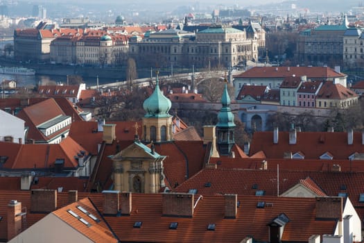 General top view of Prague cityscape view with historical gothic buildings around.