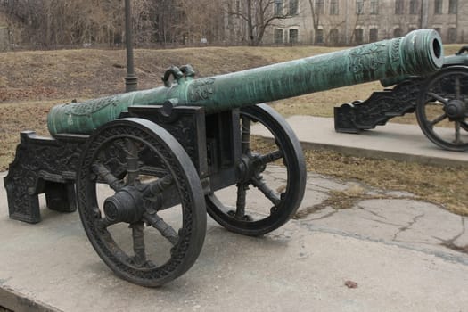 old medieval bronze cannon on the gun carriage 