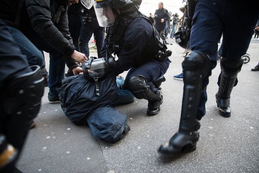 FRANCE, Paris: A protester is arrested by the police in Paris on April 5, 2016 as pupils, students and unionists demonstrate against government's planned labour reforms.