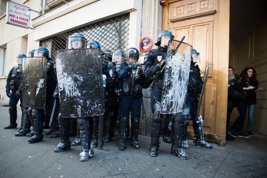 FRANCE, Paris: Clashes erupt between riot policemen and protesters in Paris on April 5, 2016 as pupils, students and unionists demonstrate against government's planned labour reforms.