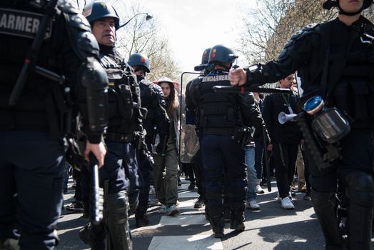 FRANCE, Paris: Clashes erupt between riot policemen and protesters in Paris on April 5, 2016 as pupils, students and unionists demonstrate against government's planned labour reforms.