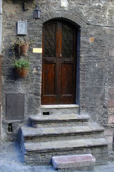 Wooden door with a stone door frame