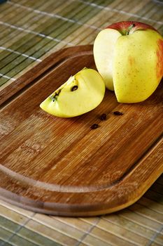 Background Still life with by cutting a apples on a kitchen board