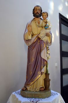 Saint Joseph holding baby Jesus