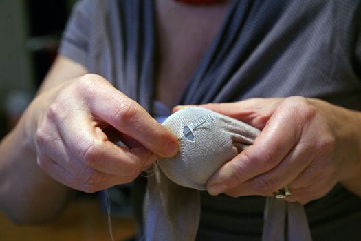 Crisis, mending socks