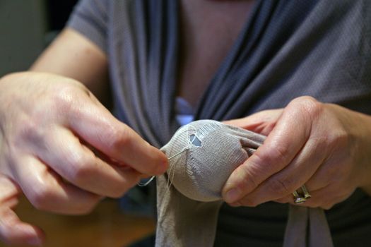 Crisis, mending socks