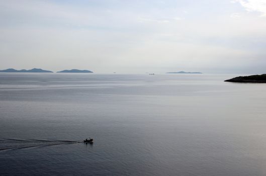 Fisherman in boat sailing out
