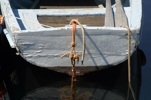 A wooden rowing boat tide down