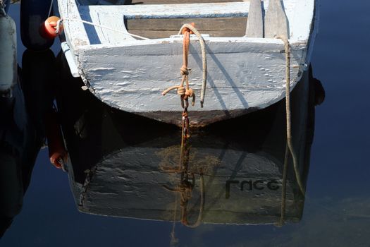A wooden rowing boat tide down