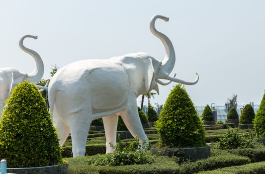 White elephant figure in the park against the sky