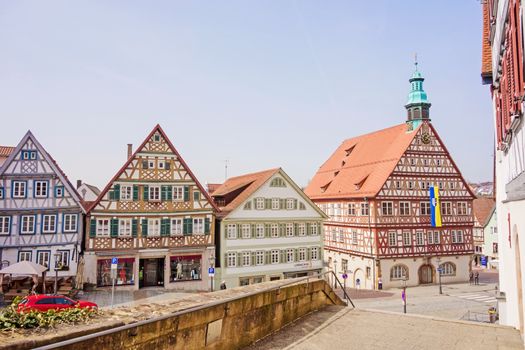 Backnang, Germany - April 03, 2016: In the city center of Backnang at marketplace, town hall on the right, half-timbered buildings.