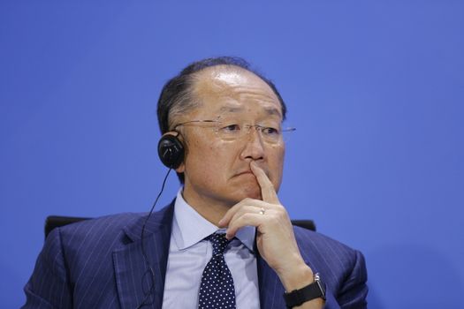 GERMANY, Berlin: World Bank President Jim Yong Kim listens to a translation during an economic meeting at the Chancellery in Berlin on April 5, 2016. The meeting focused on the long term economic outlook for Germany, Greek debt and refugees.