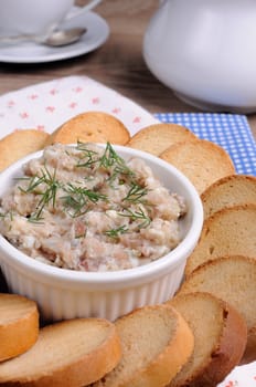 Appetizer of fish paste (forshmak ) with slices of dried baguette