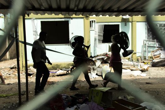 BRAZIL, Rio de Janeiro: People carry their belongings through the streets of Rio de Janeiro, Brazil on April 5, 2016 after their building exploded.Five  people were killed and nine injured in the explosion. The fire department responded to the blast in the Coelho Neto neighborhood. Neighbors reported the smell of gas leaks for over a year, however the fire department declined to comment on what may have caused the explosion. 