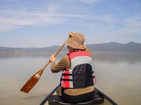 Paddling a canoe on Lake Patzcuaro, Michoacan, Mexico