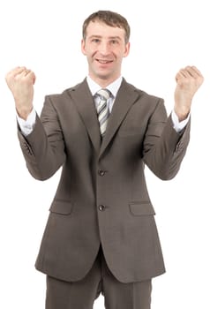 Happy businessman raised his hands up in front of him. Isolated on white background