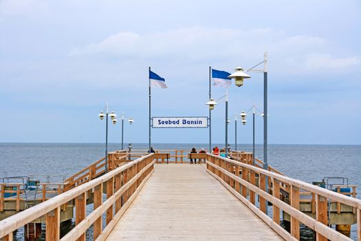 Bansin, Usedom, Germany - June 27, 2012: Pier of the baltic sea spa town Bansin - a famous tourist hotspot. Pier sign labeled with sea spa town Bansin (Seebad Bansin).