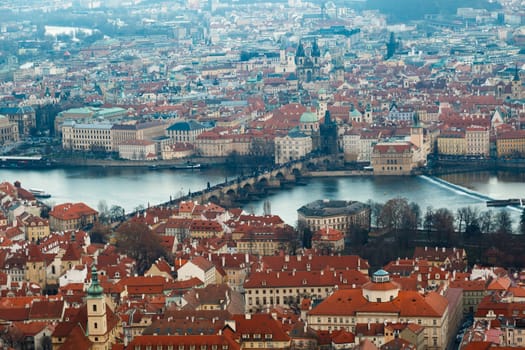 General top view of historical gothic Prague cityscape with old buildings and towers around.