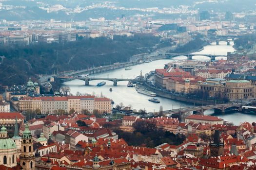 General top view of historical gothic Prague cityscape with old buildings and towers around.