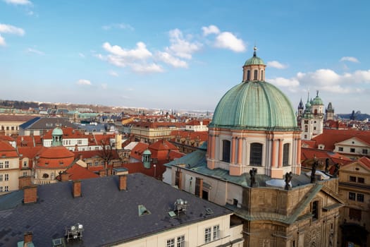 PRAGUE, CZECH REPUBLIC - DECEMBER 31, 2015 : Historical gothic cityscape view from Old Town Bridge Tower in Prague, on cloudy sky background.