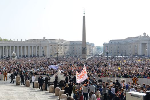 VATICAN, Vatican City: Pope Francis blesses pilgrims from his popemobile in St. Peter' Square at the end of his weekly general audience in Vatican City on April 6, 2016.