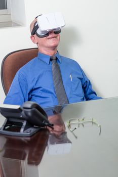 Smiling corporate executive wearing virtual reality headset