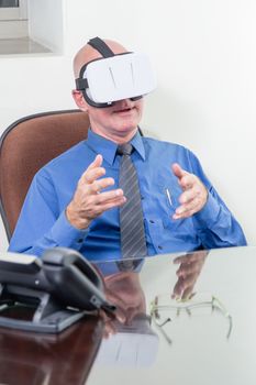 Amazed corporate executive wearing virtual reality headset