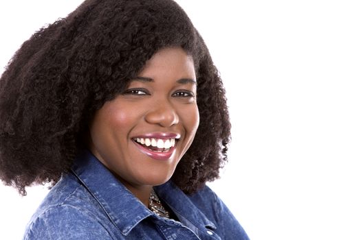 beautiful young black woman is wearing jean dress on white background