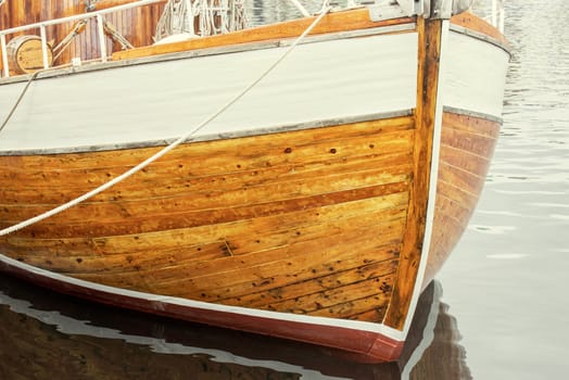 old wooden boat cleats with rope, texture background