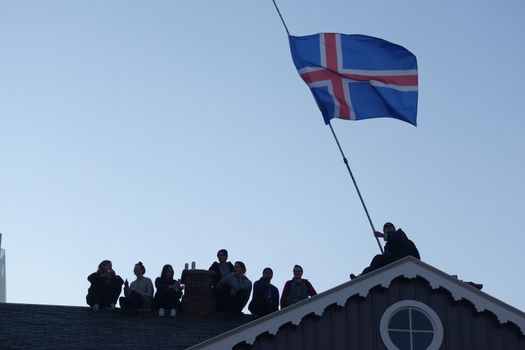 ICELAND, Reykjavik: Protesters wave an Icelandic flag as thousands rally in Reykjavik, Iceland on April 4, 2016, calling for Icelandic Prime Minister Sigmundur David Gunnlaugsson's resignation. The protest follows the Panama Papers' revelation of a global scandal surrounding secret financial dealings. The following day, Gunnlaugsson would agree to step down, though he would reportedly retain his title until a replacement has been named.